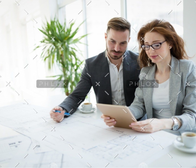 demo-attachment-337-portrait-of-young-architect-woman-on-meeting-KFZCE3A